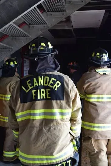 Leander firefighters in full turnout gear during a training exercise supported by MLD Services.